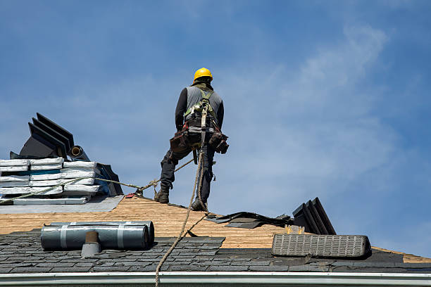 Professional Gutter Installation technician working in Ashby, MA